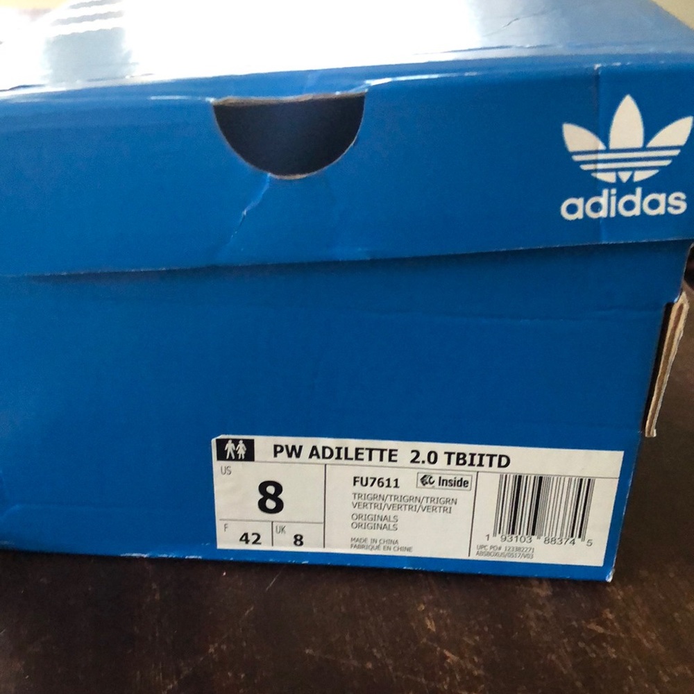 Brand new Pharrell Adilette sandals